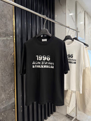 Acne Studios Stockholm 1996 Stacked‑Text Distressed‑Hem Oversized Crew‑Neck T‑Shirt
